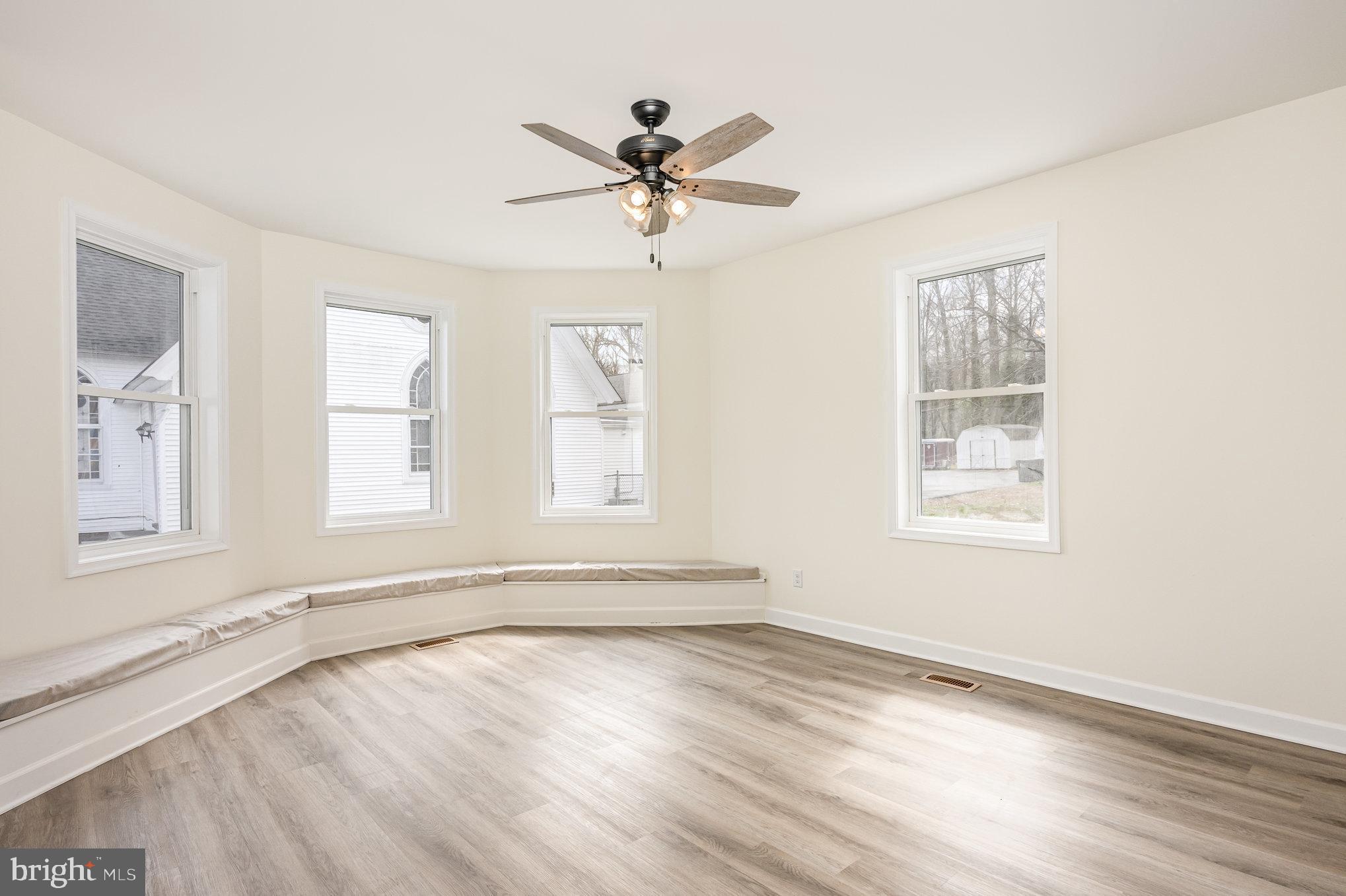 1591 Blue Ball Road Elkton, MD 21921 - Photo 5 of 30 a view of an empty room with a window and wooden floor