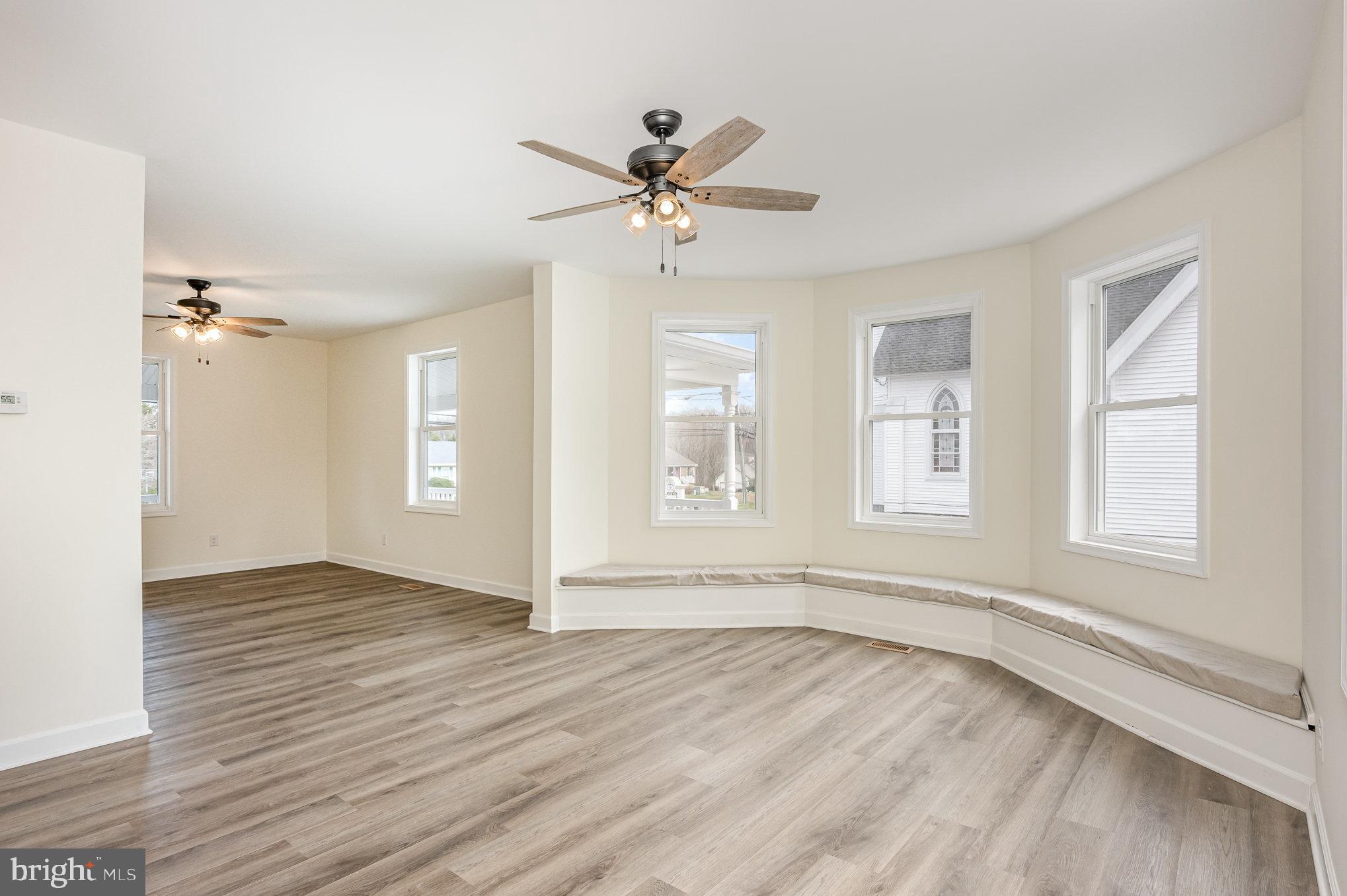 1591 Blue Ball Road Elkton, MD 21921 - Photo 6 of 30 a view of an empty room with a window and wooden floor
