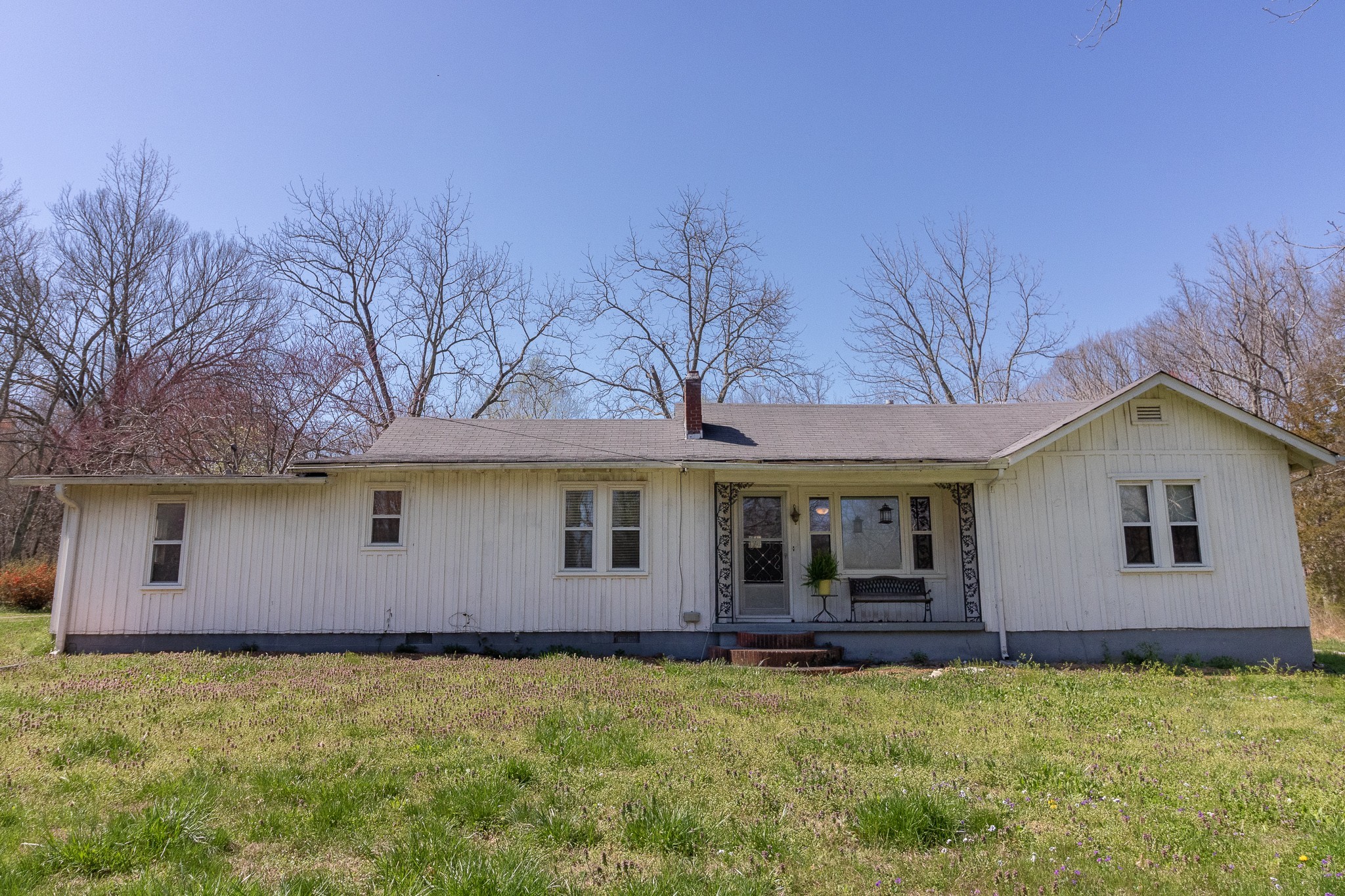 201 South Tunnel Road Portland, TN 37148 - Photo 1 of 41 a backyard of a house with large trees and barbeque oven