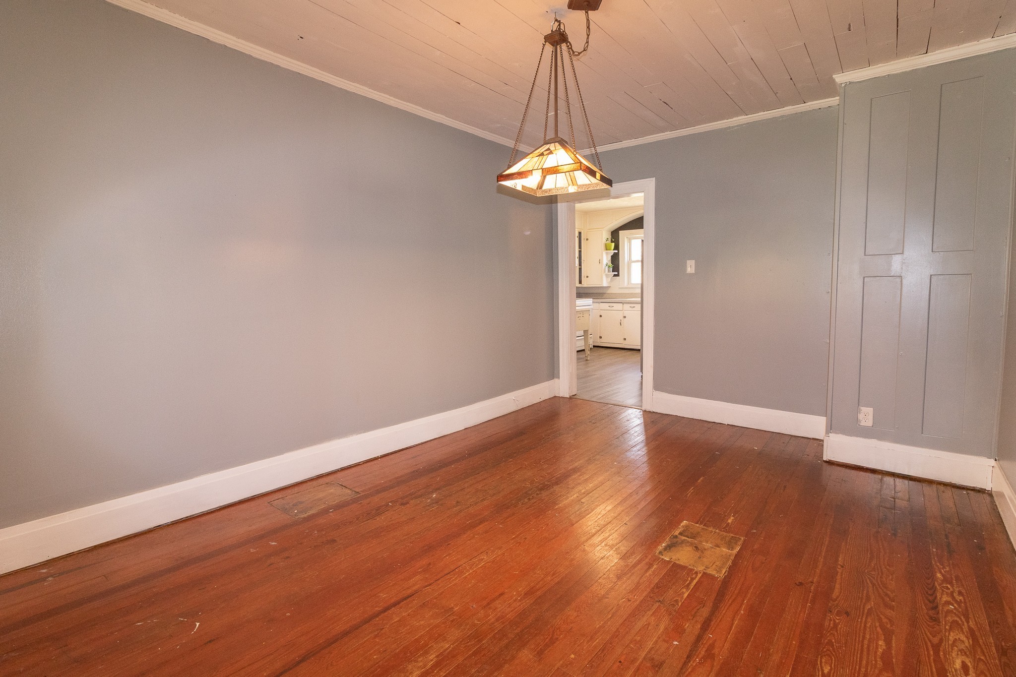 201 South Tunnel Road Portland, TN 37148 - Photo 11 of 41 a view of a room with wooden floor and a chandelier