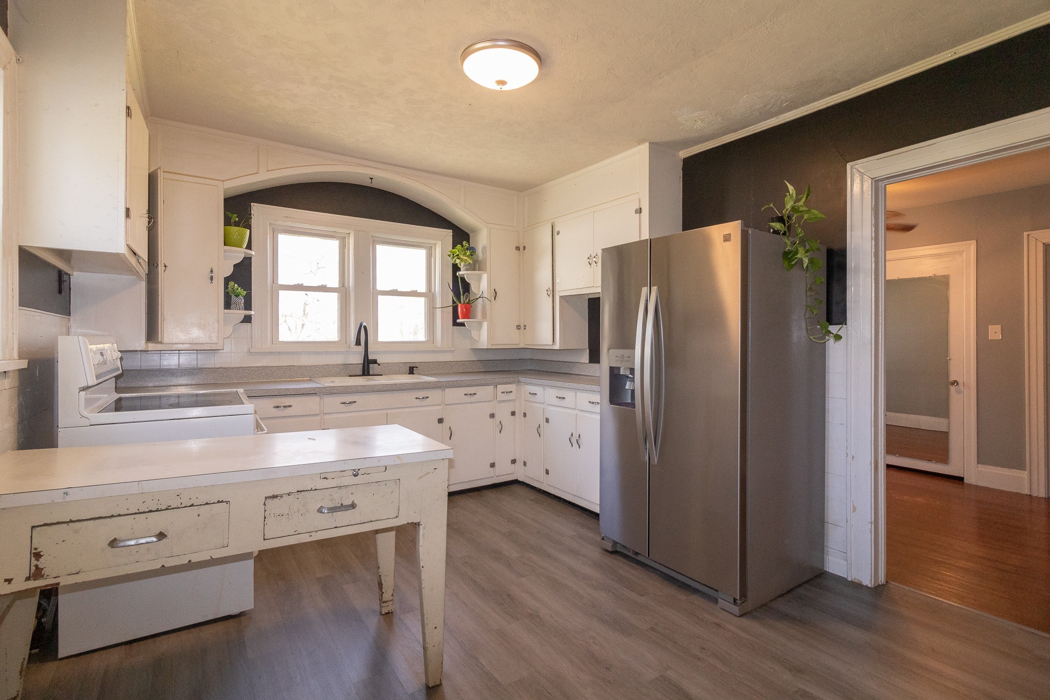 201 South Tunnel Road Portland, TN 37148 - Photo 15 of 41 a kitchen with a refrigerator sink and cabinets