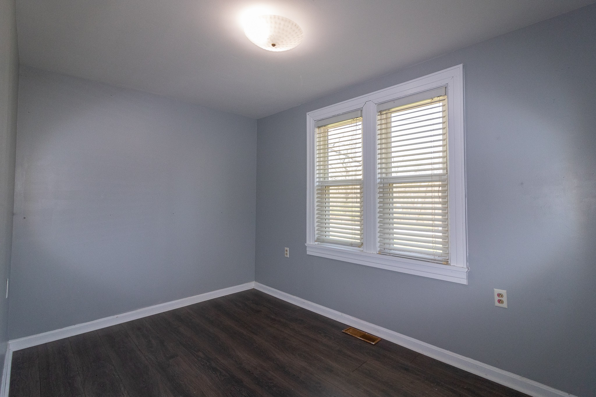 201 South Tunnel Road Portland, TN 37148 - Photo 30 of 41 a view of an empty room with wooden floor and a window