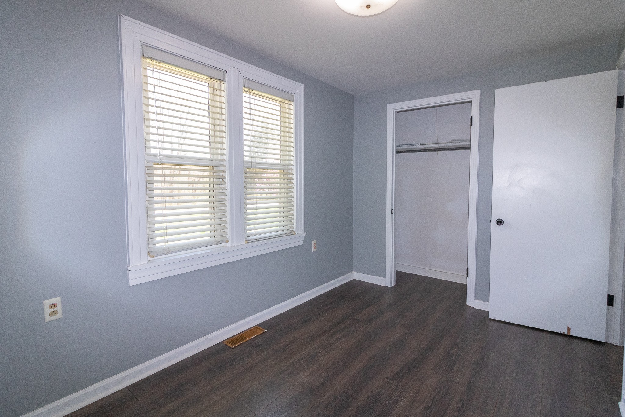201 South Tunnel Road Portland, TN 37148 - Photo 31 of 41 an empty room with wooden floor and windows
