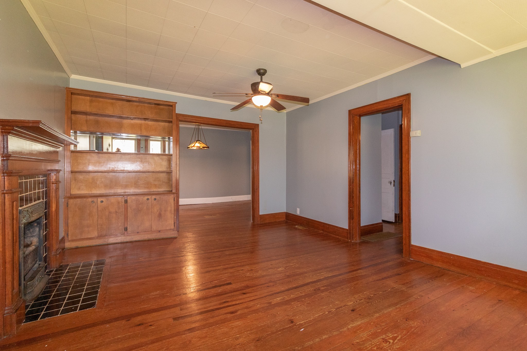 201 South Tunnel Road Portland, TN 37148 - Photo 7 of 41 a view of an empty room with wooden floor and a ceiling fan