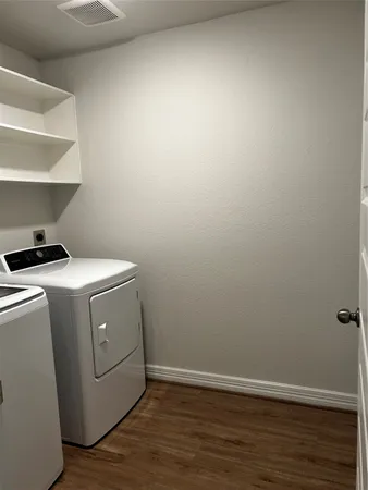 a room with a bed and a flat screen tv