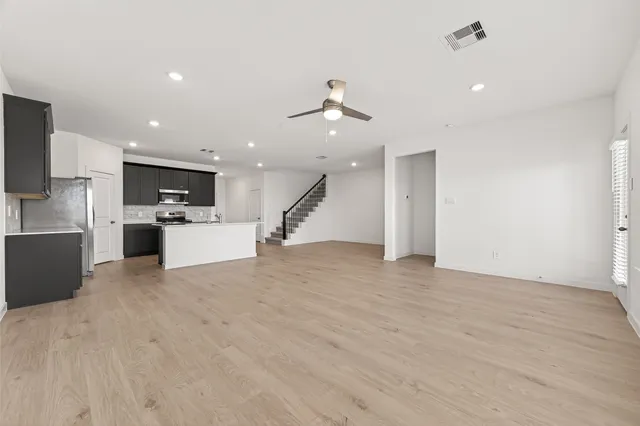 a view of kitchen with a sink and a stove top oven