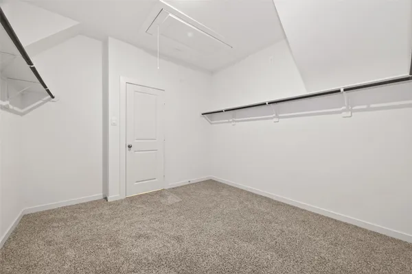 a view of empty room with windows