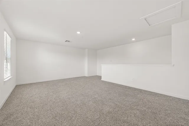 a bathroom with a sink toilet vanity and shower