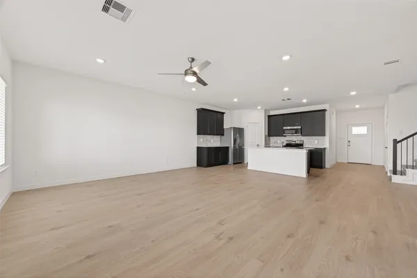 a view of kitchen with a sink and a stove top oven
