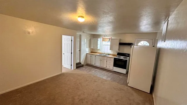 a view of a kitchen with a sink