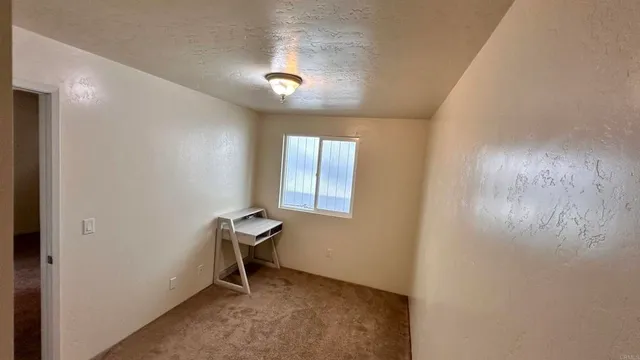 a room with workbench and window