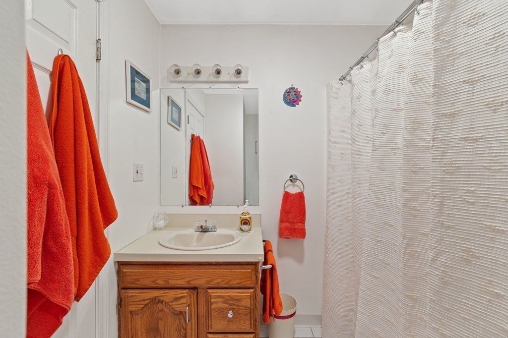 5 Bowler Road Wareham, MA 02571 - Photo 15 of 41 a bathroom with a sink and a shower curtain