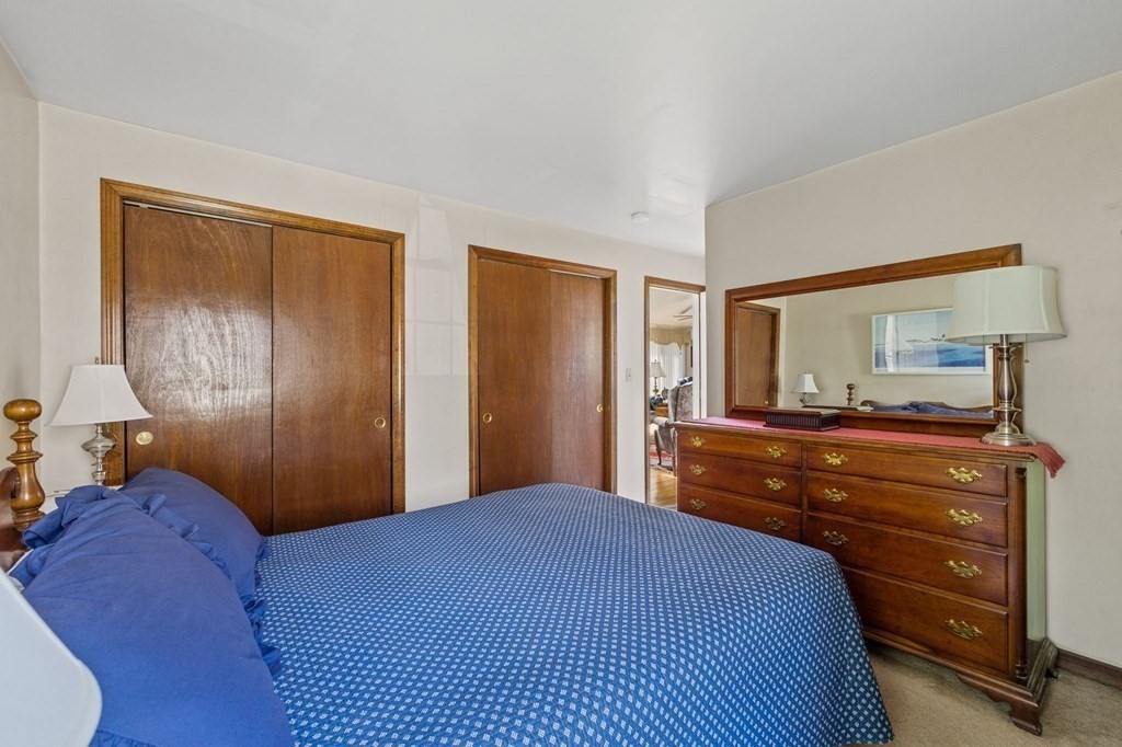 5 Bowler Road Wareham, MA 02571 - Photo 18 of 41 a bedroom with a bed and a mirror