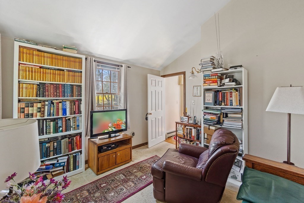 5 Bowler Road Wareham, MA 02571 - Photo 25 of 41 a living room with a couch and a book shelf