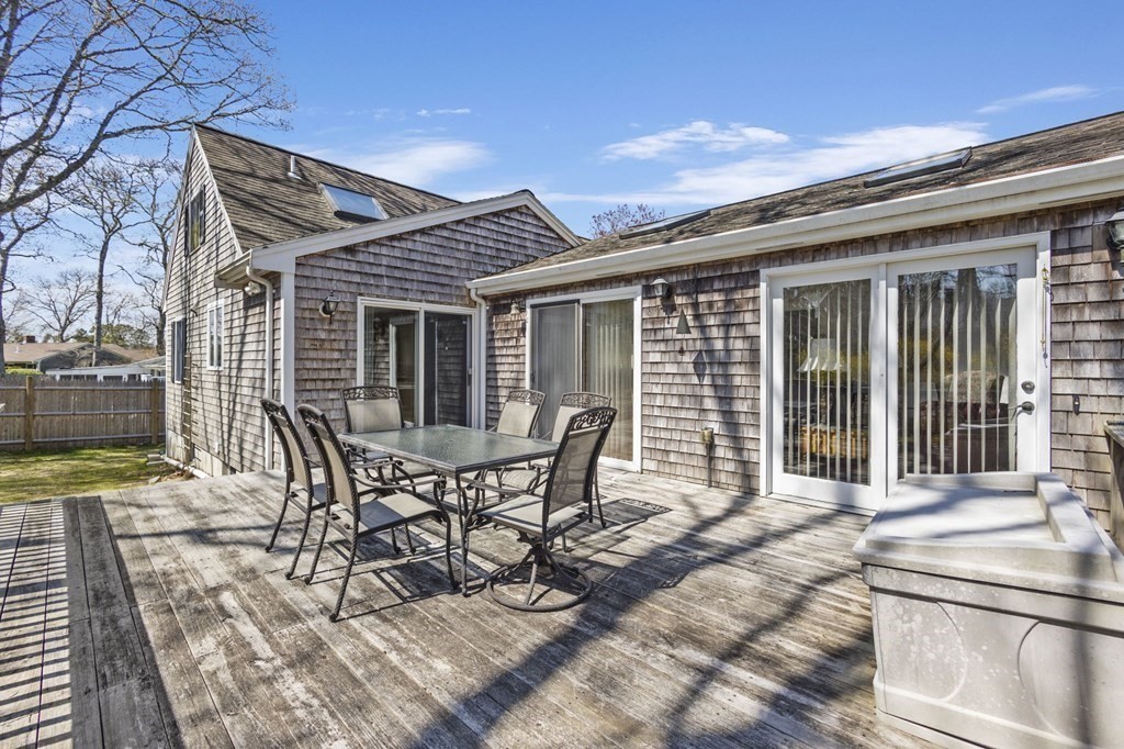 5 Bowler Road Wareham, MA 02571 - Photo 30 of 41 a patio with table and chairs and potted plants