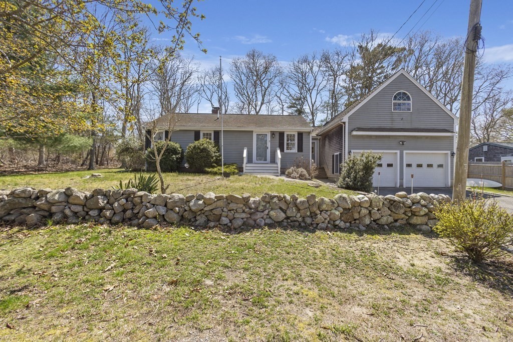 5 Bowler Road Wareham, MA 02571 - Photo 3 of 41 a front view of a house with a yard