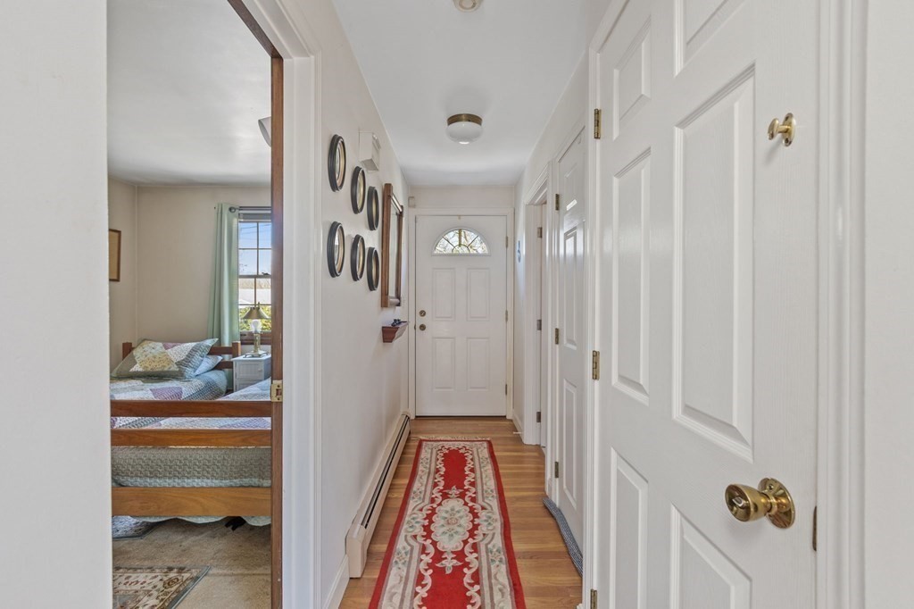 5 Bowler Road Wareham, MA 02571 - Photo 4 of 41 a view of a hallway to a livingroom and a dinning area with furniture