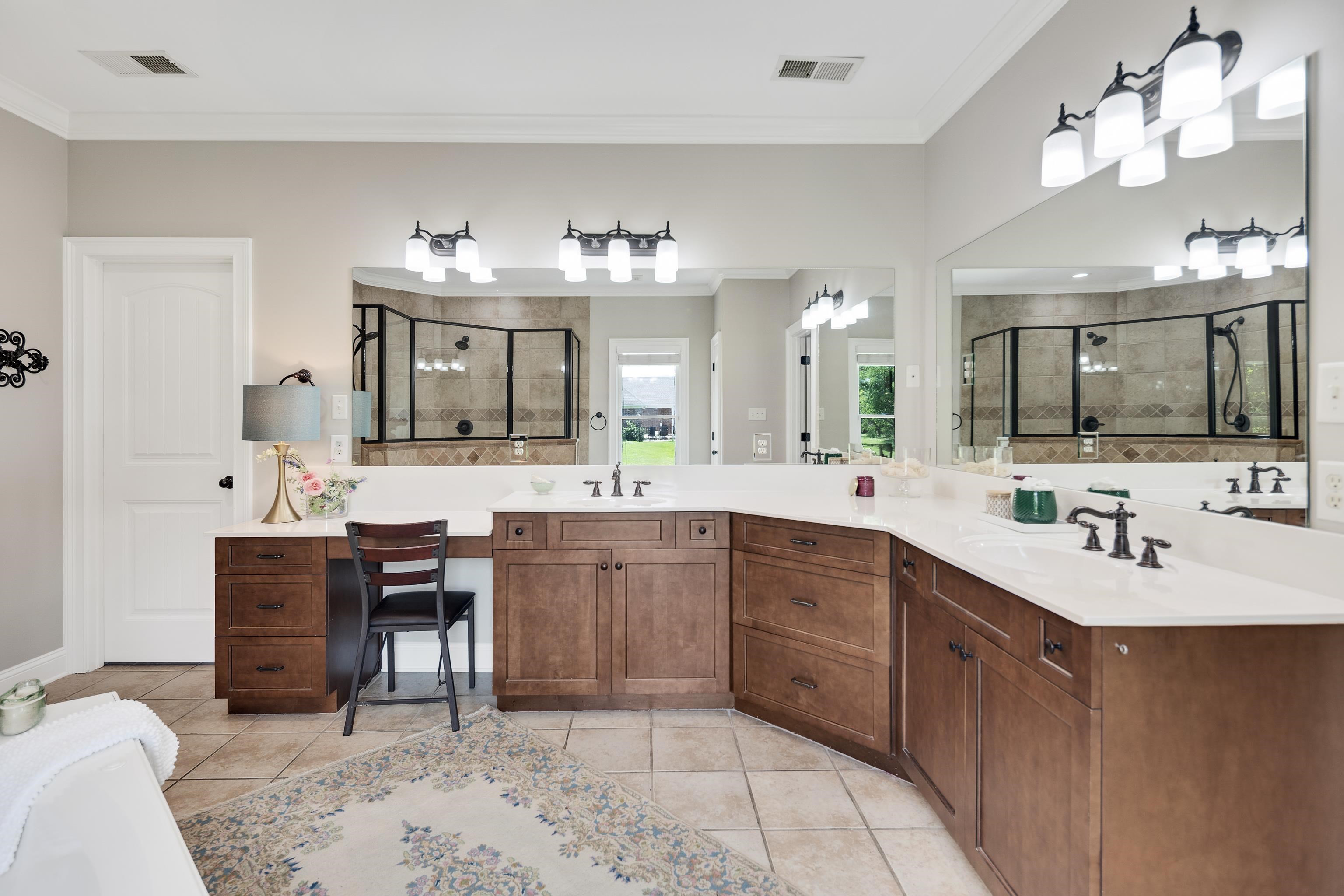 9028 Osborntown Road Arlington, TN 38002 - Photo 22 of 40 a bathroom with a sink vanity and mirror