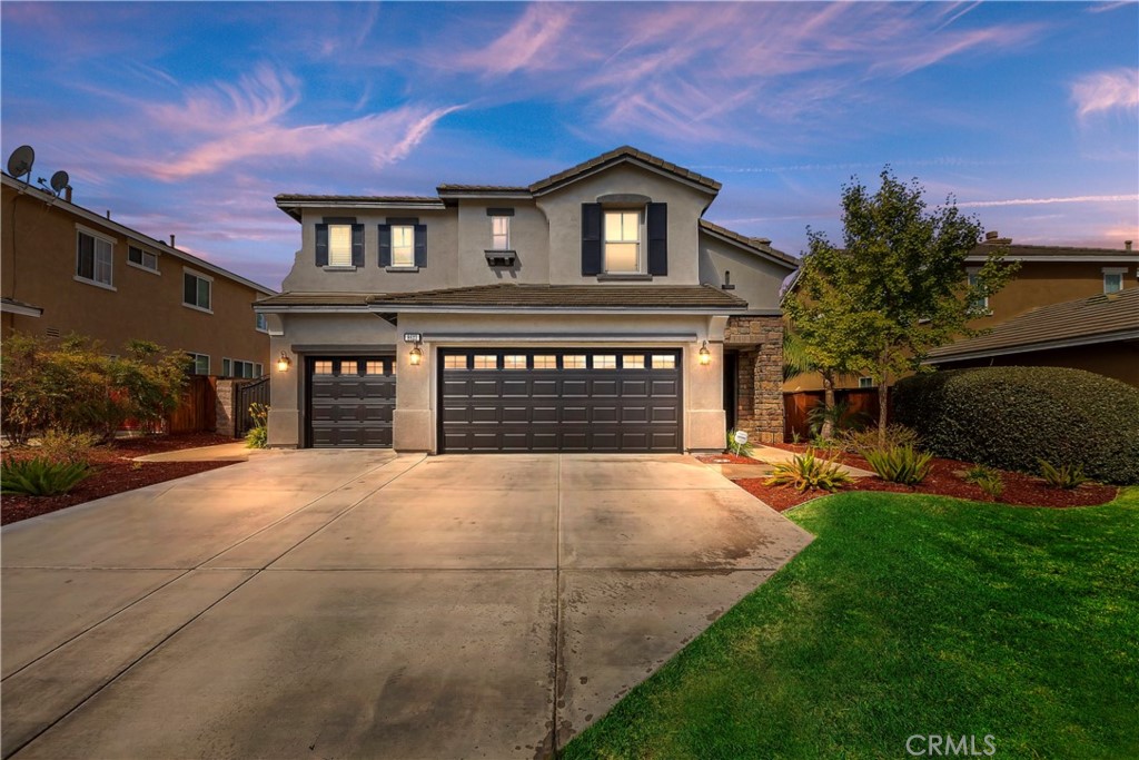 8623 Lodgepole Lane Riverside, CA 92508 - Photo 1 of 1 a front view of a house with a yard and garage