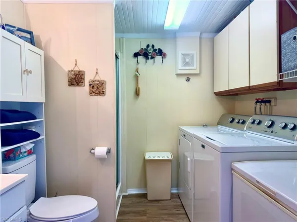 a bathroom with a sink toilet and mirror