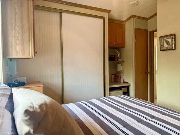 a kitchen with a refrigerator and cabinets