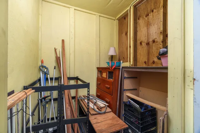 a living room with fireplace furniture and a large window