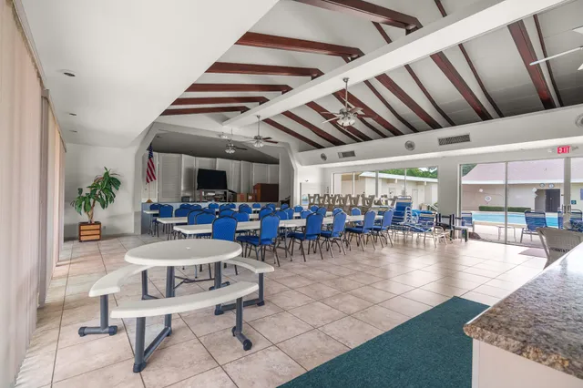 a dining room with furniture and a book shelf