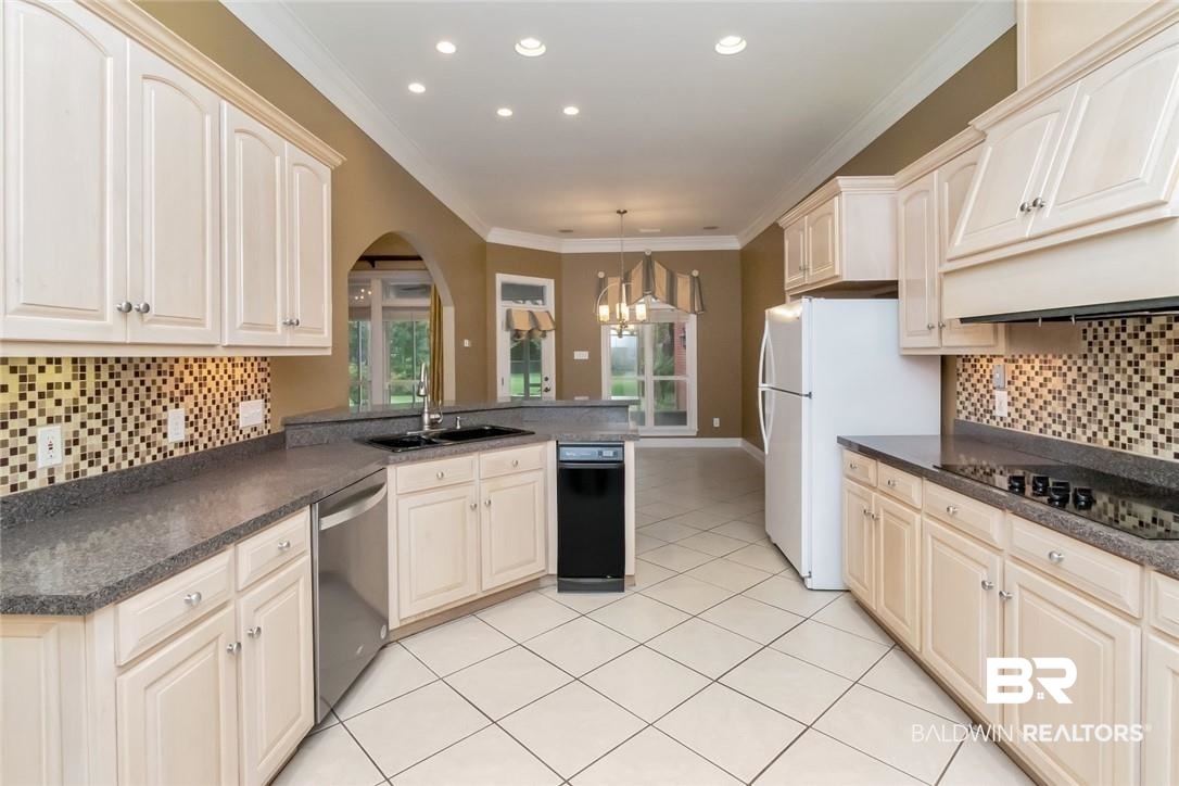 8837 Dawes Lake Road South Mobile, AL 36619 - Photo 9 of 44 Kitchen featuring white refrigerator, sink, kitchen peninsula, pendant lighting, and stainless steel dishwasher