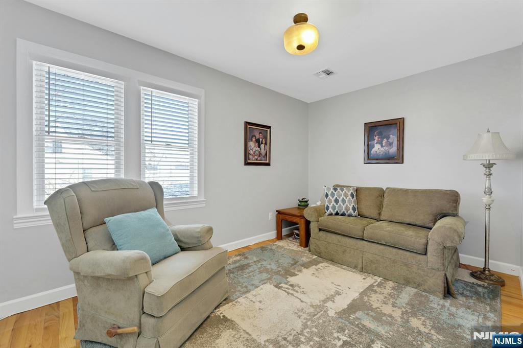 19 Hamilton Avenue Kearny, NJ 07032 - Photo 14 of 33 a living room with furniture and a window