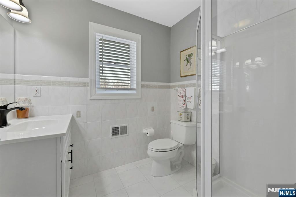 19 Hamilton Avenue Kearny, NJ 07032 - Photo 15 of 33 a bathroom with a toilet sink and shower