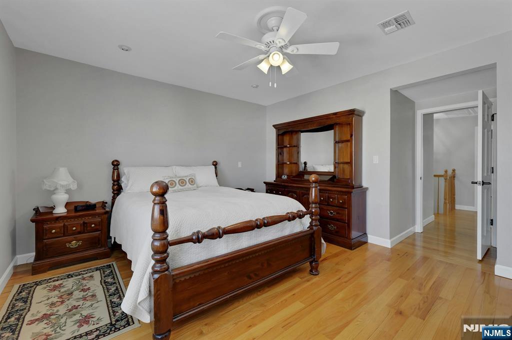19 Hamilton Avenue Kearny, NJ 07032 - Photo 17 of 33 a bedroom with a bed and a chandelier
