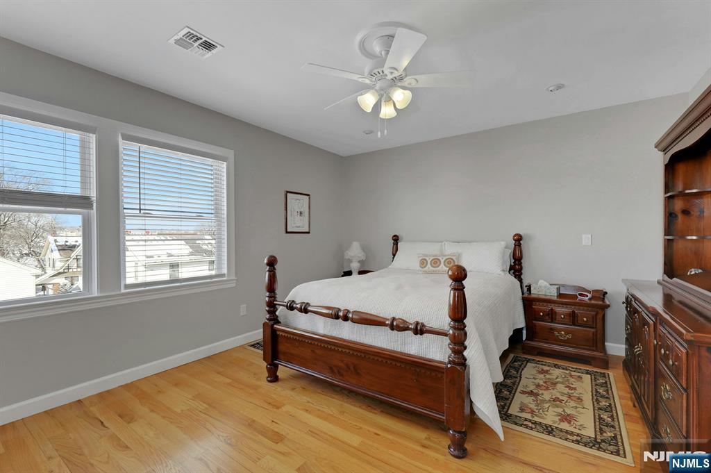 19 Hamilton Avenue Kearny, NJ 07032 - Photo 18 of 33 a bed sitting in a bedroom next to a window