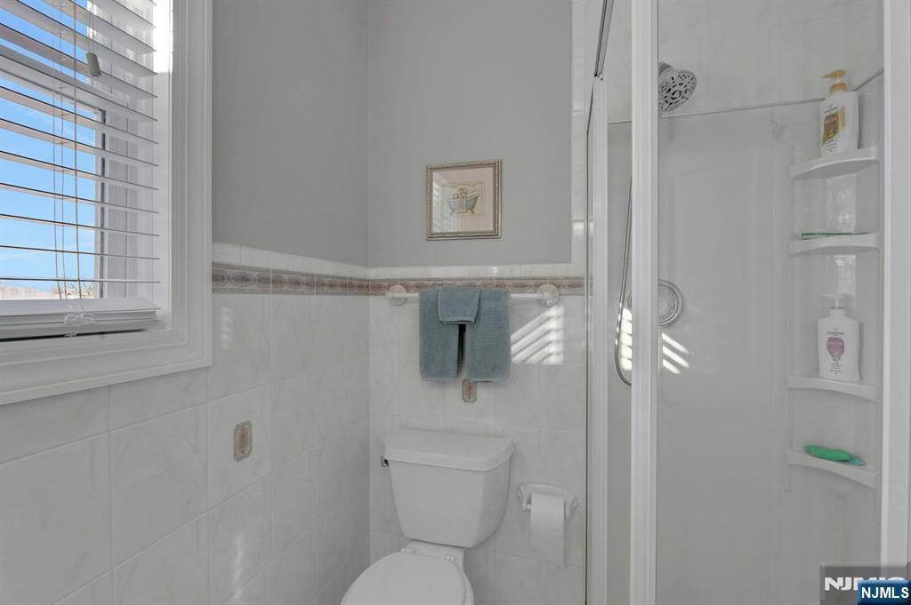 19 Hamilton Avenue Kearny, NJ 07032 - Photo 20 of 33 a bathroom with a toilet and a shower