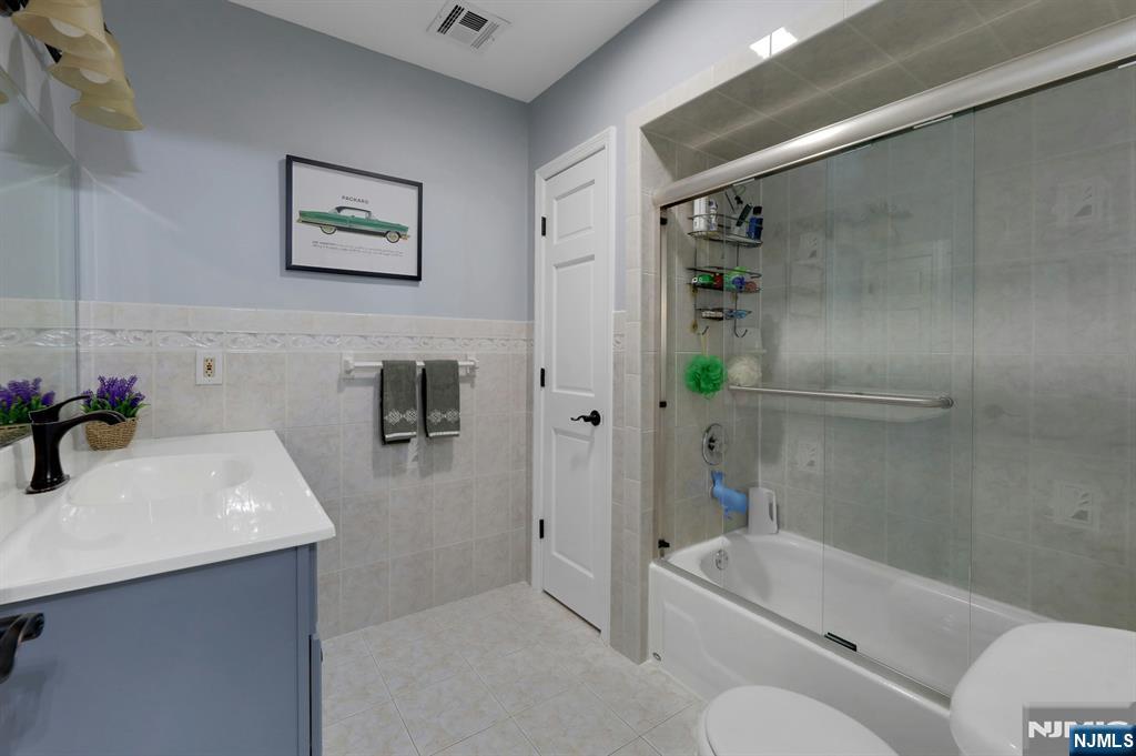 19 Hamilton Avenue Kearny, NJ 07032 - Photo 27 of 33 a bathroom with a sink a toilet and shower