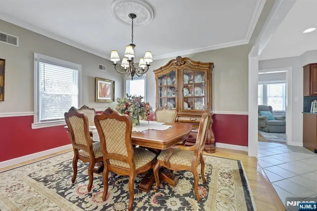 a living room with fireplace furniture and a large window