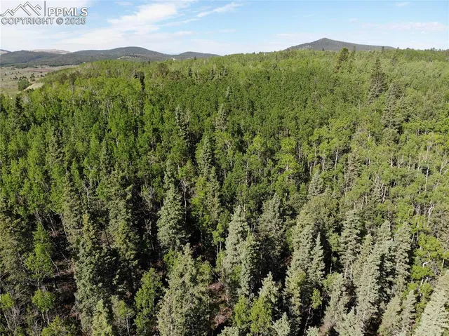 a view of mountain view with mountains in the background