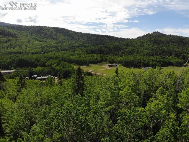 a view of a lake with houses in the back