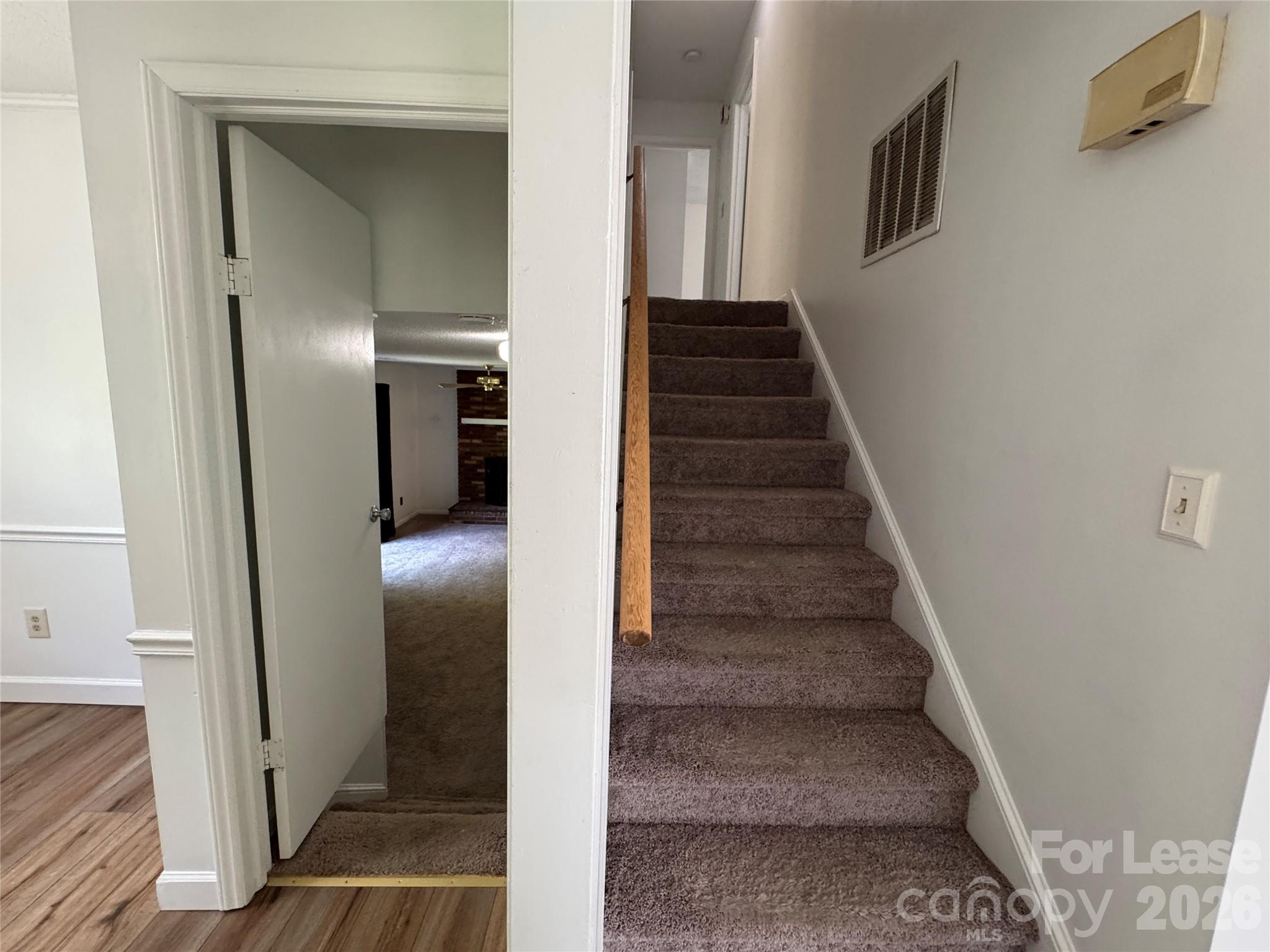 315 Pine Road Mount Holly, NC 28120 - Photo 6 of 21 a view of entryway and hall with wooden floor