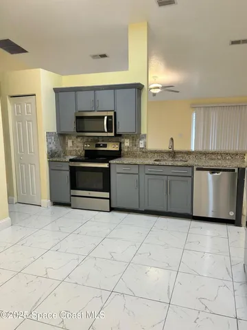 a view of a livingroom with a furniture