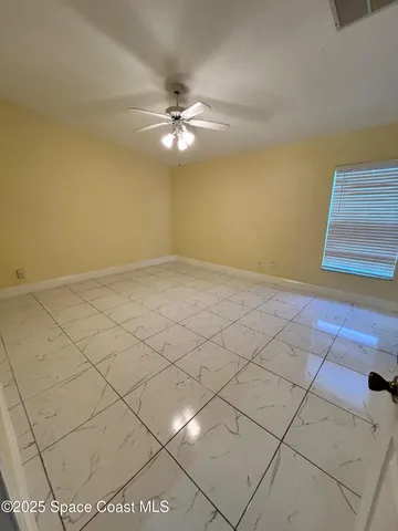 a bathroom with a shower and a glass door