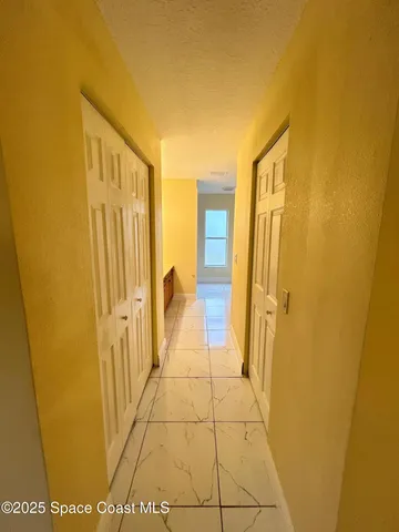 a view of a room with racks on the wall