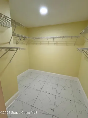 a view of a room with racks on the wall