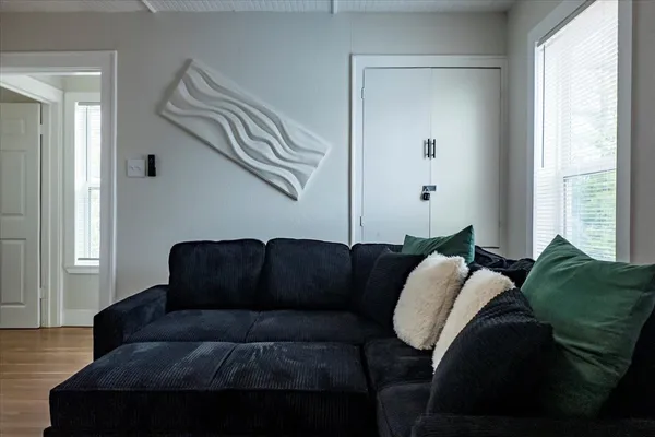 a living room with furniture and a window