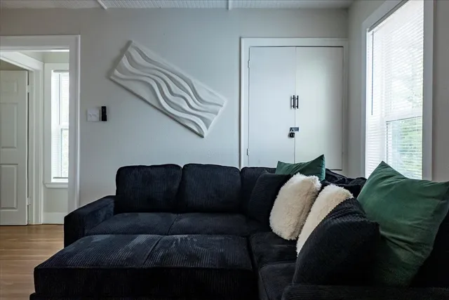 a living room with furniture and a window