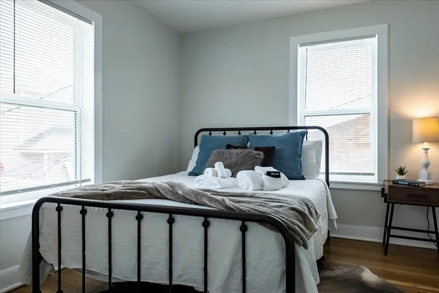 a bedroom with a bed and a window