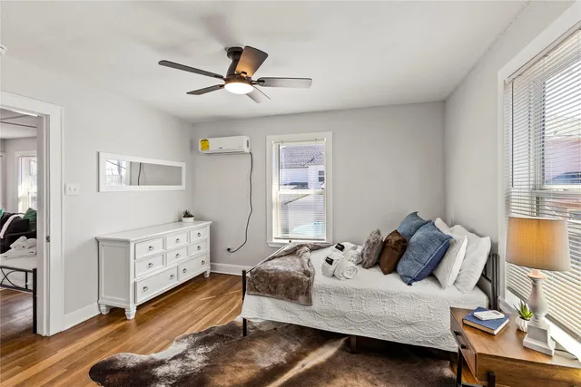 a bedroom with a bed and window