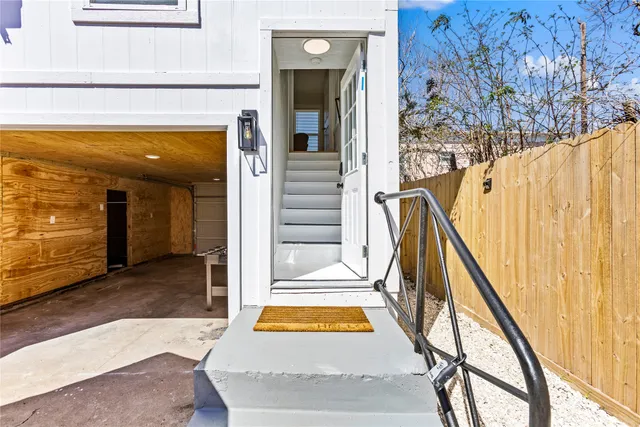 a view of swimming pool with table and stairs