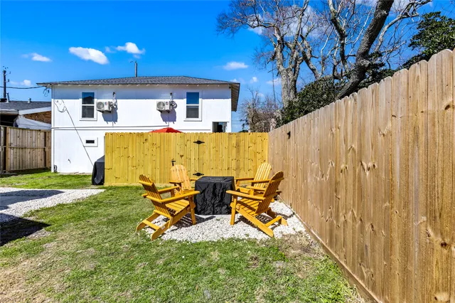 a view of swimming pool with outdoor seating and yard