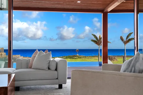 a living room with furniture and a lamp