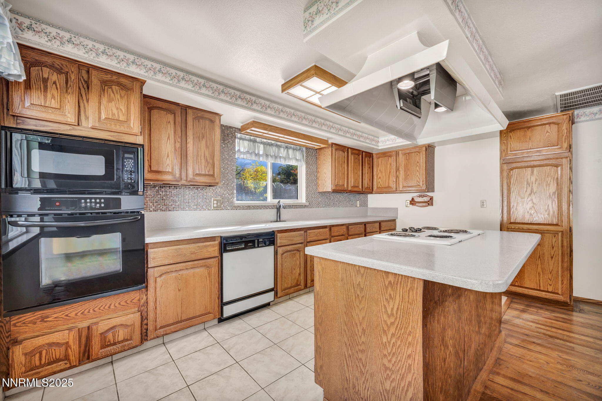 3370 Shawnee Circle Reno, NV 89502 - Photo 15 of 78 a kitchen with stainless steel appliances granite countertop a sink stove and microwave